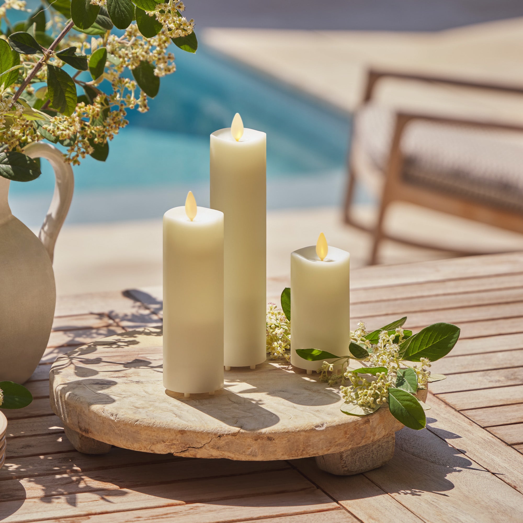 sm-image-35a2c0044a8c953cc0fa4981 Set of 3 Pearl Ivory Outdoor Flameless Candle Slim Pillars with Remote - Melted Top